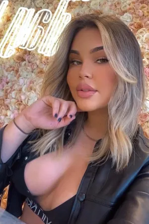 Sofi brunette taking a selfie in public wearing a bra